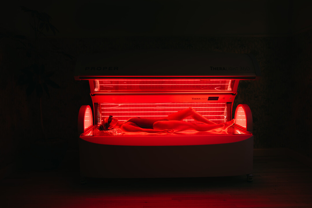 women having full-body therapy on TheraLight 360 Red Light Bed