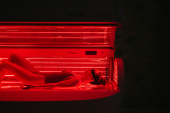 women having full-body red light therapy on Theralight 360 Bed