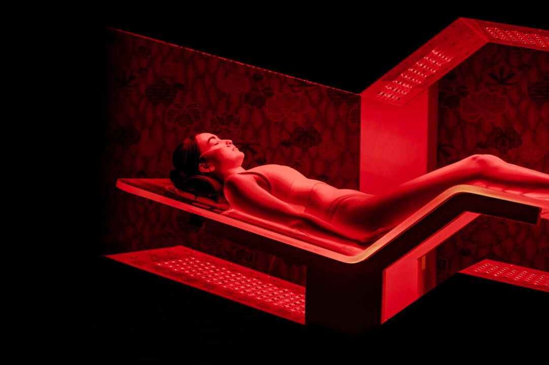 Person in recovery room having full-body Joovv red light therapy