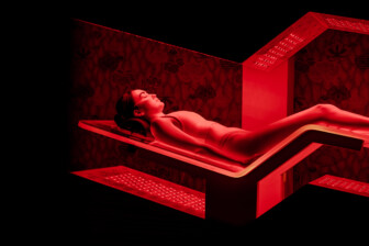 Person in recovery room having full-body Joovv red light therapy
