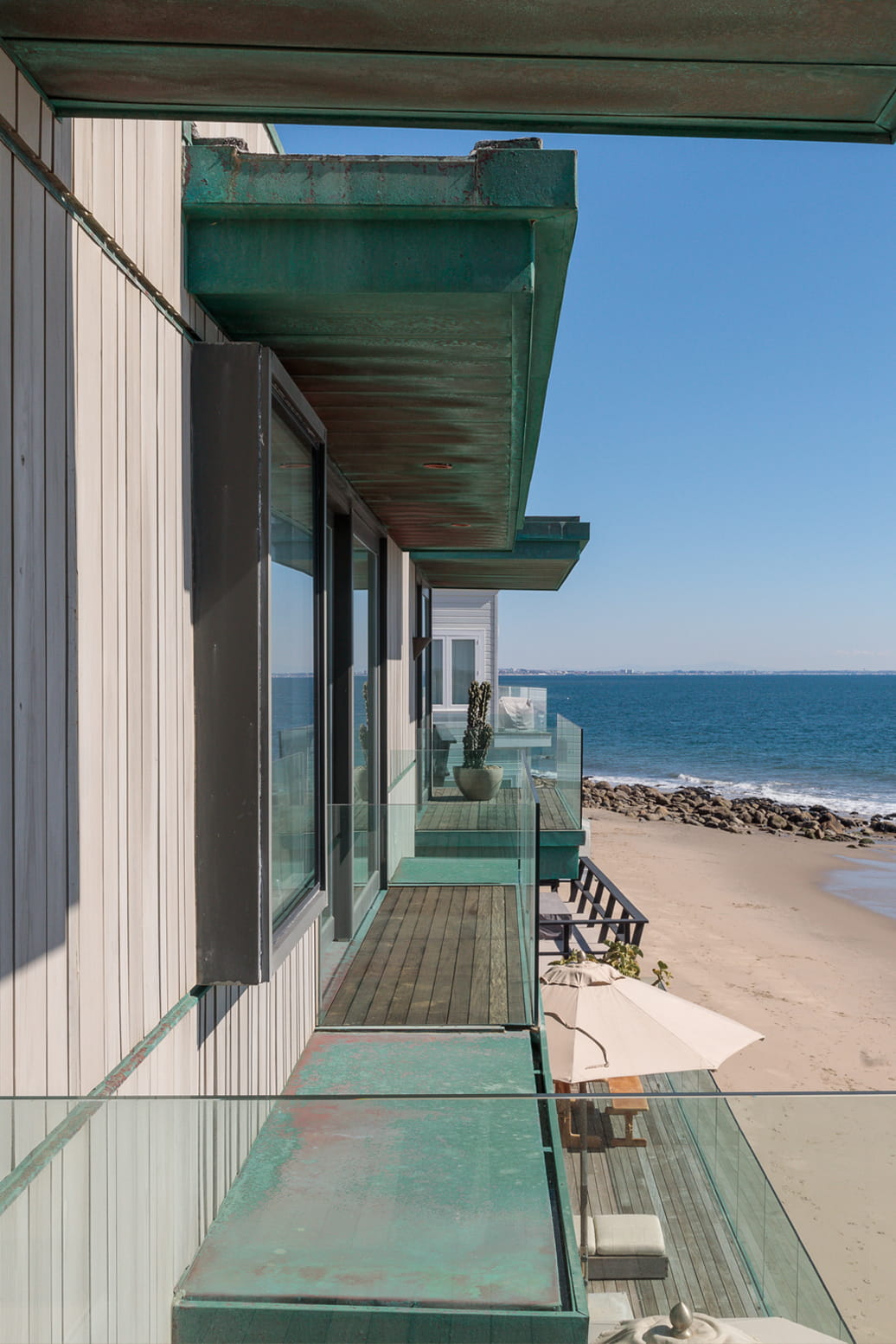 Side view of malibu beach house showing multiple bedroom balconies