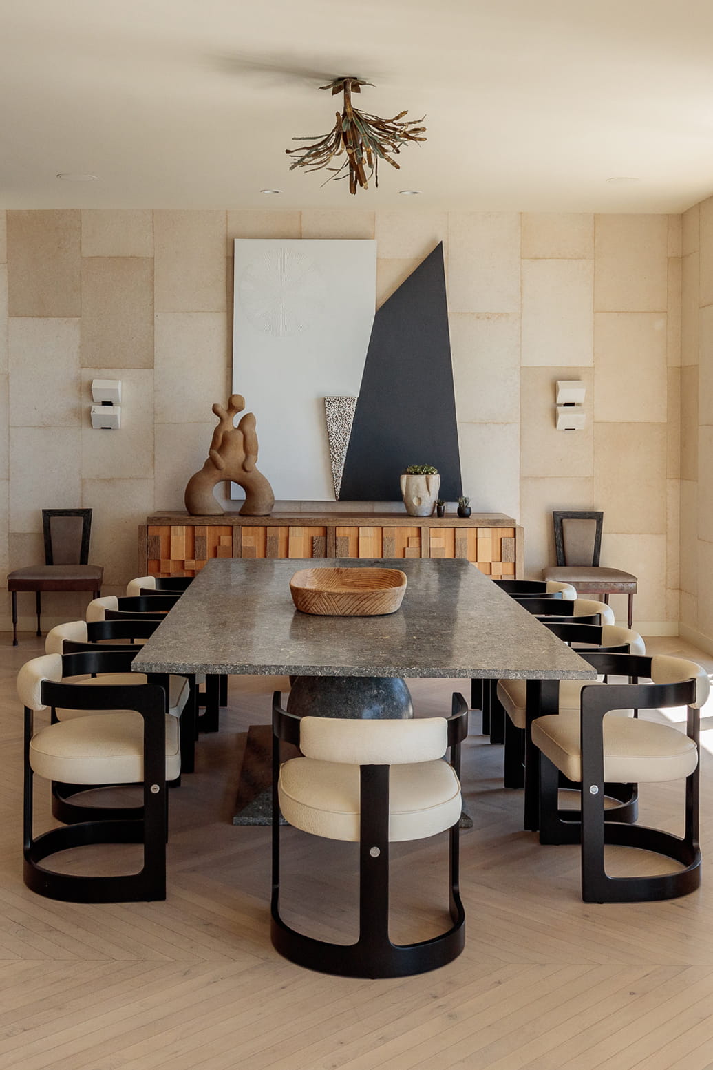 Dining Room with massive table, decorative chandelier and many chairs