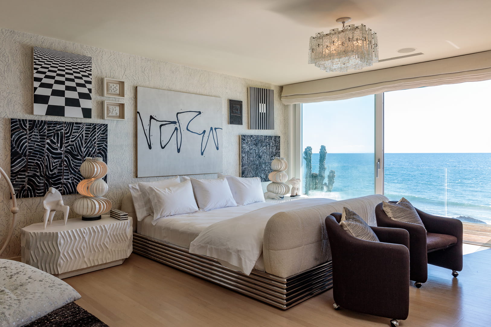 Malibu Beach House master bedroom with ocean front balcony and kelly wearstler custom decor